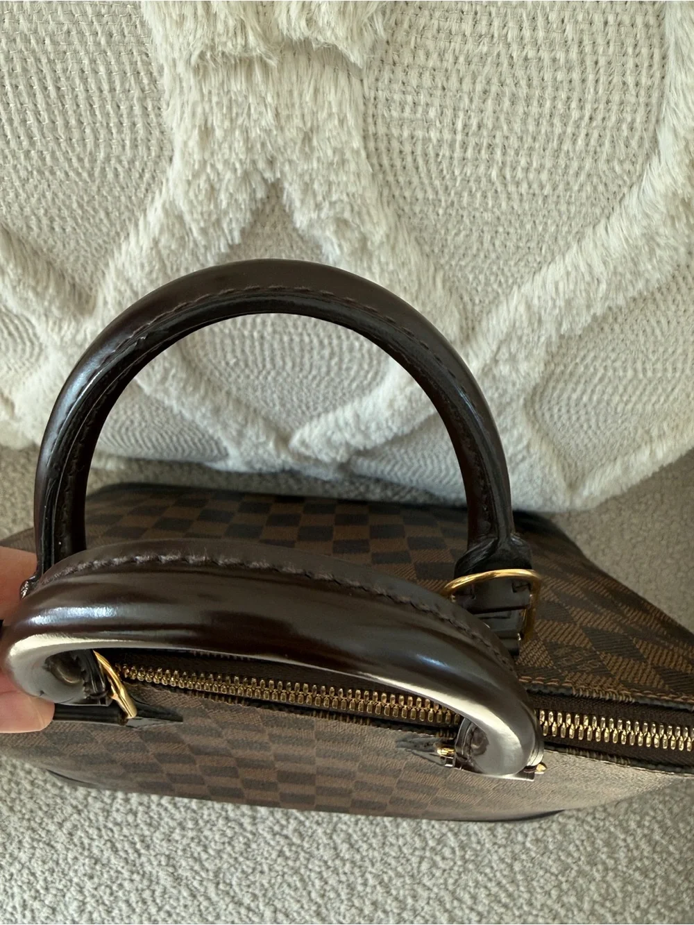Louis Vuitton imperfections lock